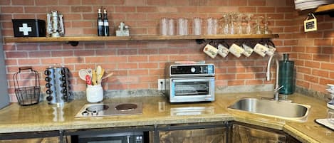 Fridge, microwave, stovetop, coffee/tea maker