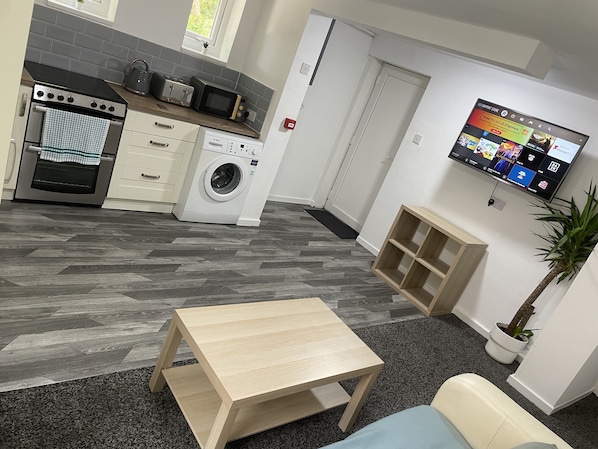 Comfort Apartment | Living area | Flat-screen TV
