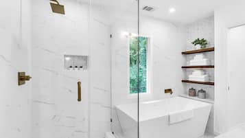 Combined shower/tub, hair dryer, towels, soap