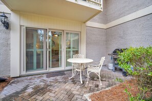 Enjoy al fresco dining on the patio with a barbecue grill nearby.