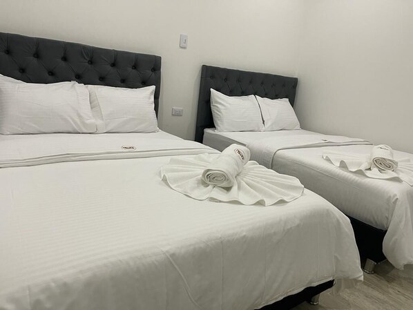 Standard Triple Room | Individually decorated, desk, laptop workspace, iron/ironing board