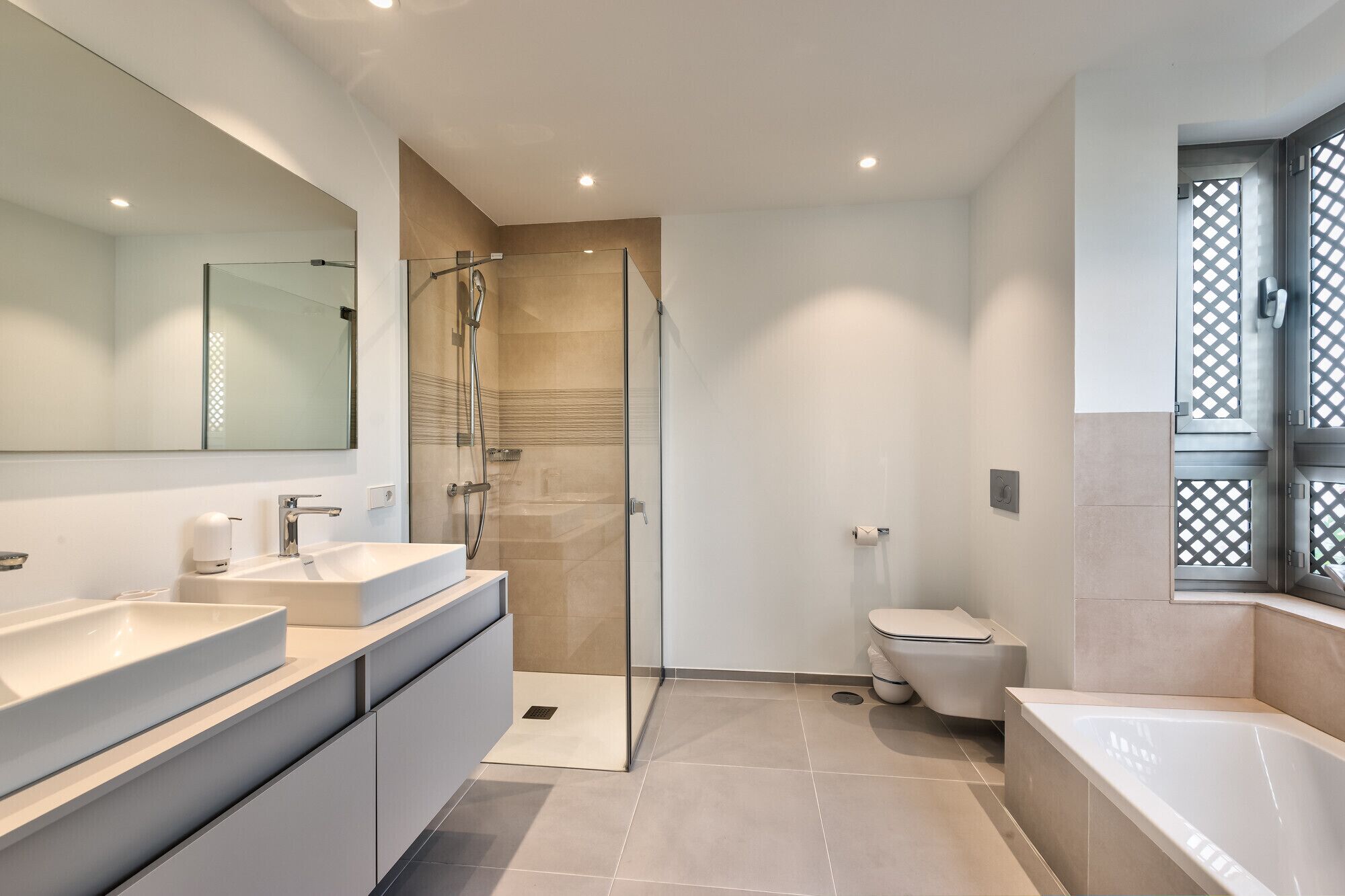 Main bathroom with bathtub and shower
