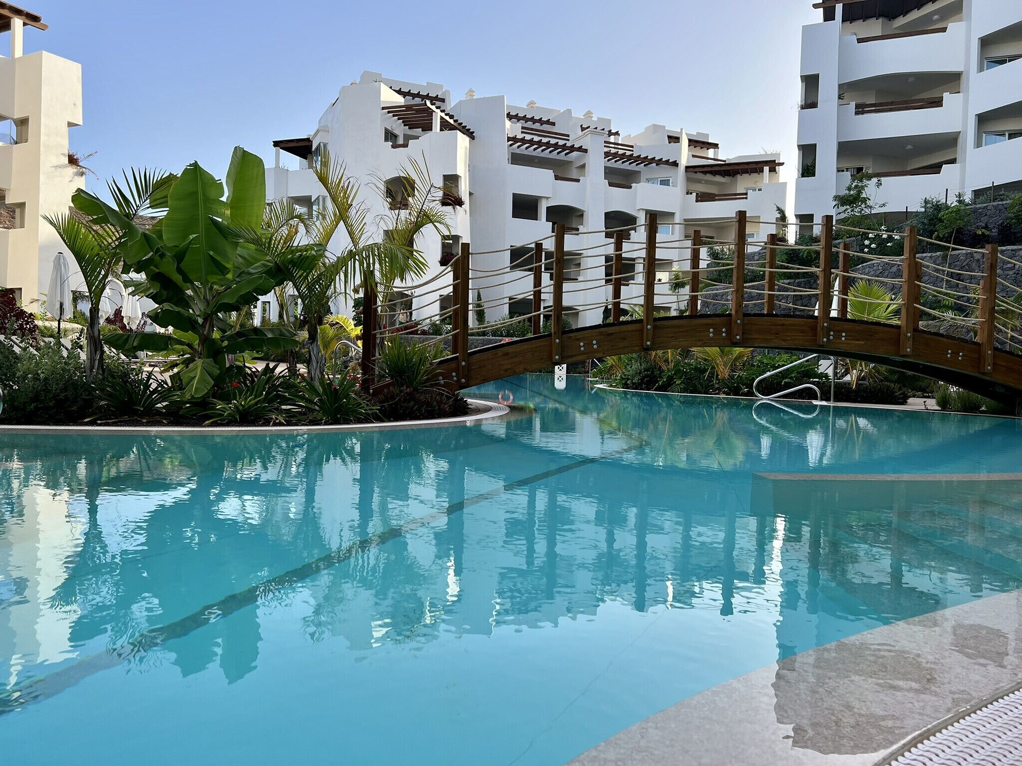 A heated pool, sun loungers