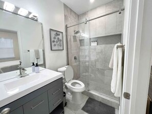 Combined shower/bathtub, hair dryer, towels, soap