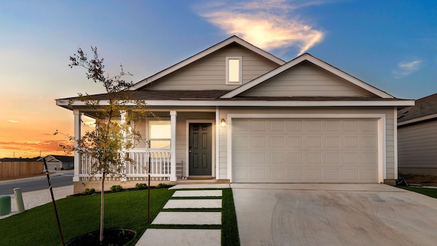 A single-story house with a front porch, a garage, and a well-maintained lawn.