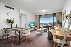 Kitchen table, lounge area and work space area.