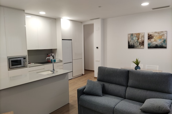 Apartamento galeria | Área de estar | TV de tela plana