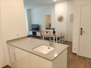 Departamento Gallery | Área de sala de estar | Televisión de pantalla plana