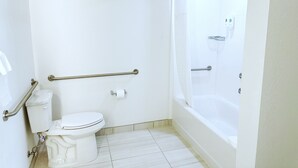 A bathroom with a toilet, a shower, and a bathtub. - Comfort Inn & Suites Panama City Beach - Pier Park Area (Panama City Beach)