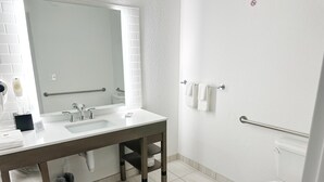 A modern bathroom with a white sink, mirror, and toilet. - Comfort Inn & Suites Panama City Beach - Pier Park Area (Panama City Beach)