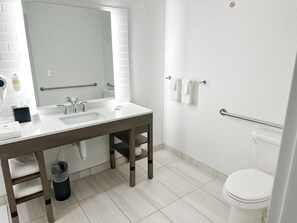 A modern bathroom with a white sink, mirror, and toilet. - Comfort Inn & Suites Panama City Beach - Pier Park Area (Panama City Beach)