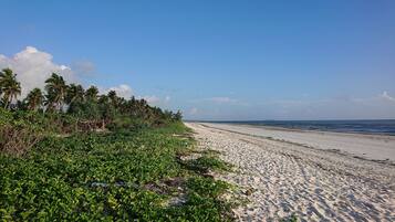 Beach nearby, white sand, beach towels, beach massages
