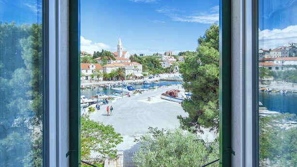 A view of a harbor with boats, a church, and buildings. - 3 Bedroom Villa, Private Pool, Brac Island (Sumartin)