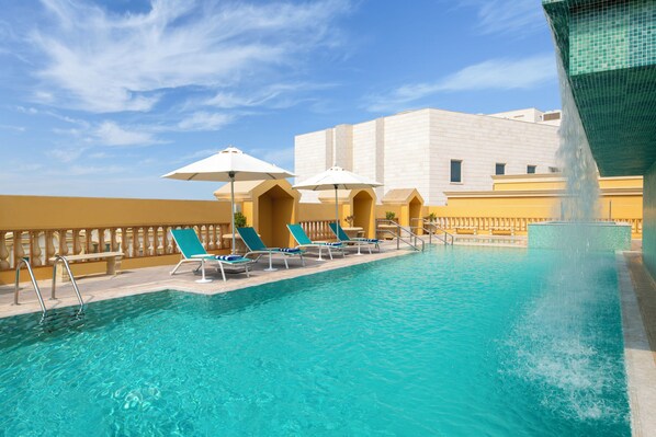 Outdoor pool, pool umbrellas, pool loungers