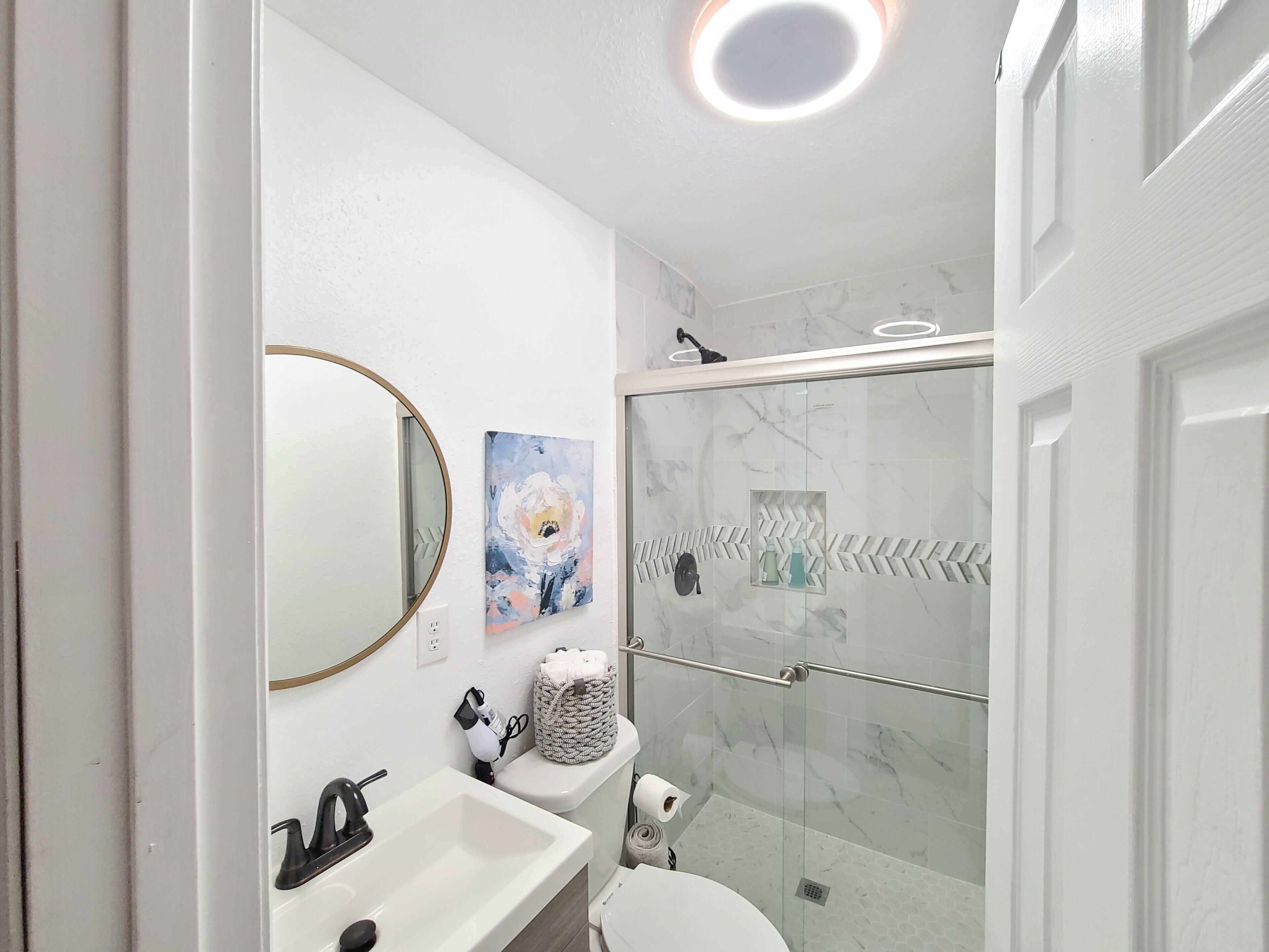 Shower, hair dryer, towels, soap