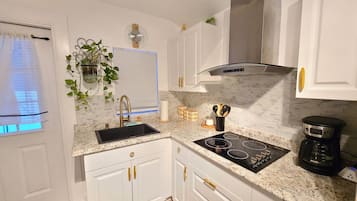Fridge, microwave, stovetop, coffee/tea maker