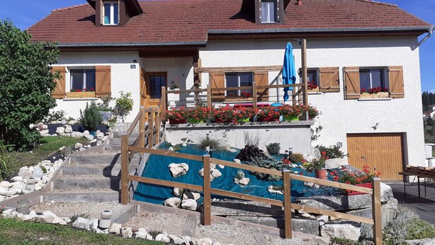 A two-story house with a sloped roof, wooden shutters, and a stone pathway leading to the entrance. - Fully-equipped Meublé de Tourisme for rent, sleeps 6 (Discounts + nights) (nanchez)