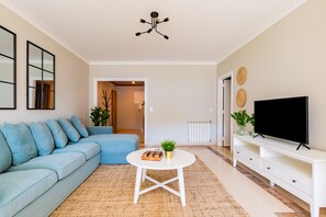 Apartment, 2 Bathrooms | Living area | 32-inch TV with cable channels