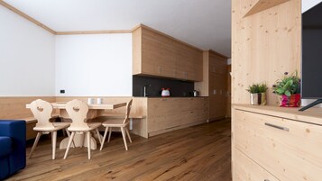 Apartment (1 Bedroom) | Living area | 55-inch flat-screen TV with cable channels, TV