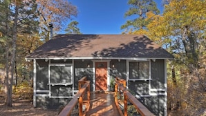 A cabin with a wooden deck and a covered entrance. - Closer to the Stars Fire Pit Dog-Friendly (Big Bear Lake)