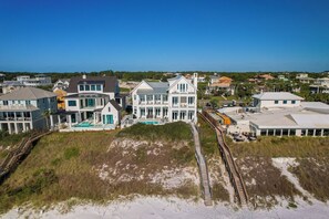 A coastal property with multiple houses, a swimming pool, and a beach access path. - 30A Stunner! Gulf Views, Private Pool, Beach & Golf Cart | Fall Now Booking! (Santa Rosa Beach)