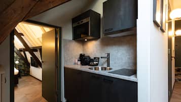 Presidential Suite | Private kitchen | Mini-fridge, coffee/tea maker, electric kettle