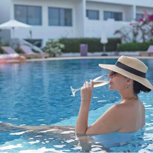 Outdoor pool, open 9:00 AM to 7:00 PM, pool umbrellas, pool loungers