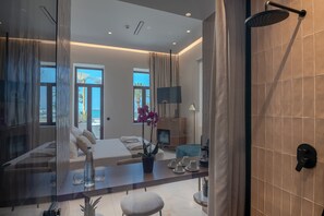 Executive Suite, Sea View (Outdoor Jetted Tub) | Bathroom | Shower, rainfall showerhead, hair dryer, slippers - Omma Suites (Rethymno)