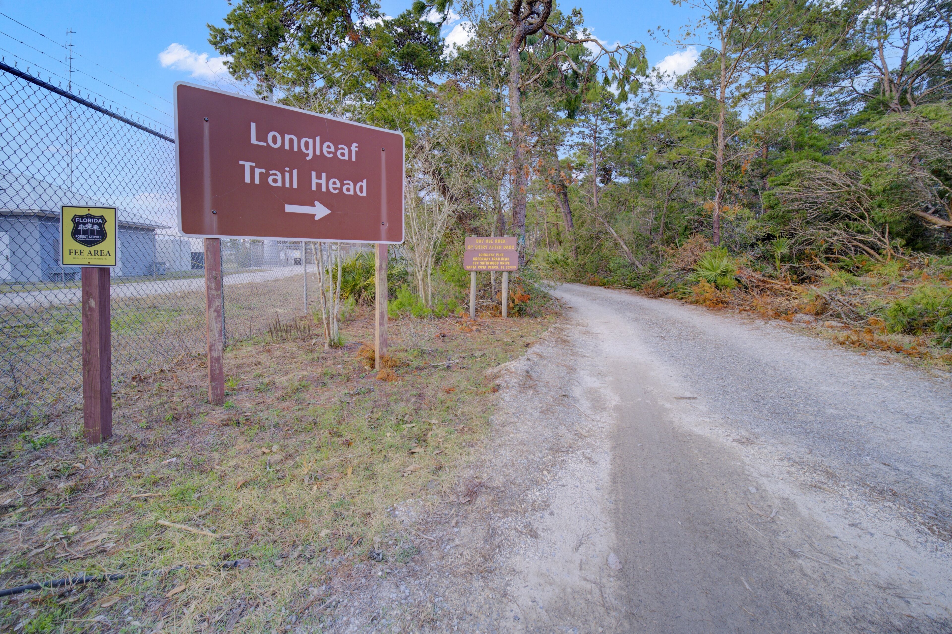 A sign for Longleaf Trail Head with a direction arrow.