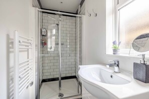 Bathtub, hair dryer, towels