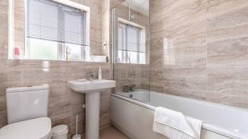Bathtub, hair dryer, towels
