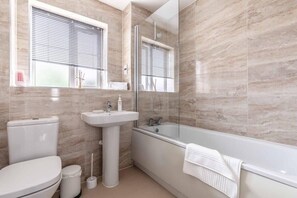 Bathtub, hair dryer, towels