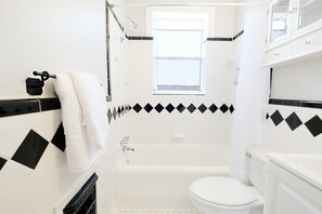 Combined shower/bathtub, hair dryer, towels, soap