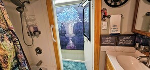 Bathtub, hair dryer, towels, soap