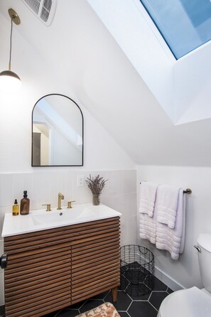 Shower, eco-friendly toiletries, hair dryer, towels