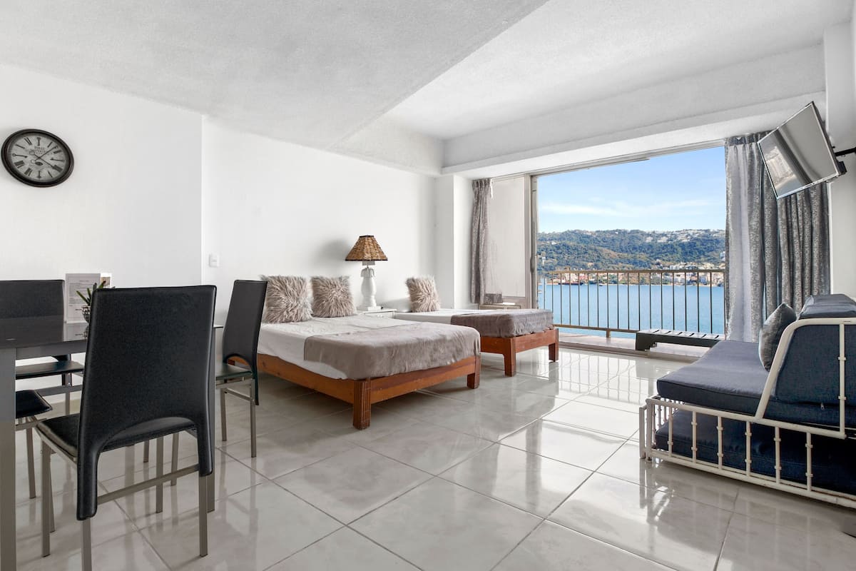 Habitación cuádruple básica, 1 habitación, vista a la playa | Decoración personalizada, wifi gratis y ropa de cama