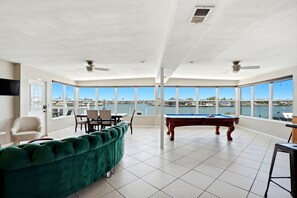 Games room - Spacious 3BR WATERFRONT escape with dock, pool table, SUPs, beach gear, sunsets, and a quick 3 minute walk to the sand. Perfect for families, groups, and memory-making stays in the heart of Indian Rocks Beach.  3/2, Sleeps up to 7.  Bring your boat! (Indian Rocks Beach)