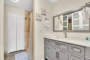 Combined shower/tub, hair dryer, towels, soap