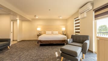 Room, 1 King Bed, Non Smoking (Efficiency) | Living area | 32-inch LED TV with cable channels, TV