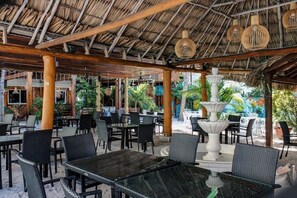 Outdoor dining - Upper-Floor, by pool bar @ Sapphire Beach Resort (San Pedro Town)