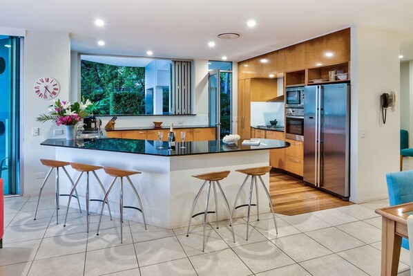 Panoramic Apartment | Private kitchen | Full-size fridge, microwave, oven, stovetop