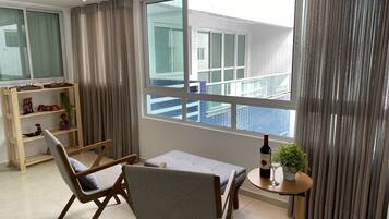 Family Apartment | Living area | 32-inch Smart TV with cable channels, TV