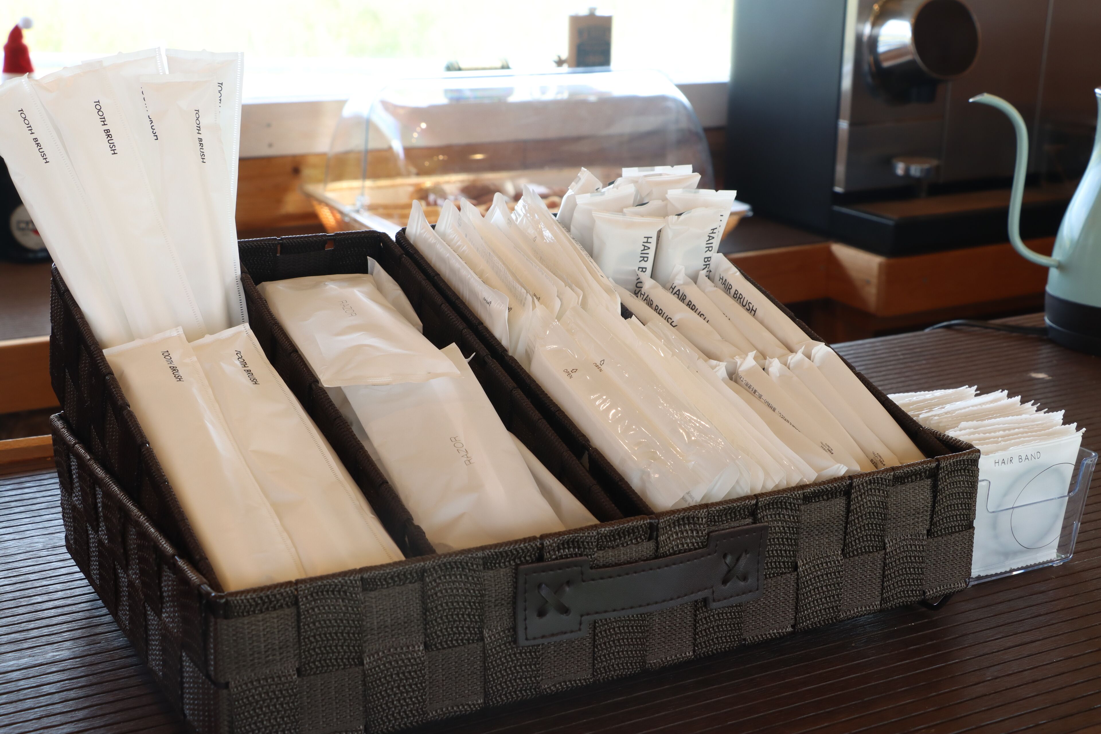 A storage box containing various hair care products.
