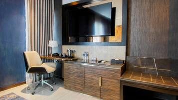 Deluxe Double Room | Living area | 55-inch Smart TV with cable channels, TV