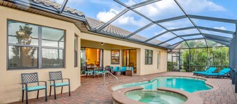 Bonita National dog-friendly home with a lanai, pool, pool spa, and home office