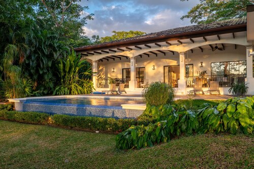 Luxe tropical villa with private pool, fairway views & on-site golf/pools/tennis