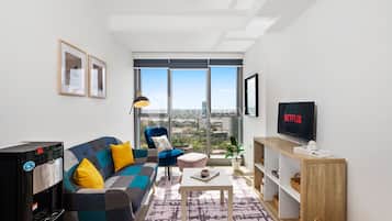 Apartment, 1 Bedroom, City View | Living area | TV