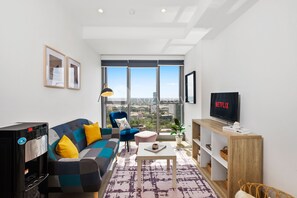 Apartment, 1 Bedroom, City View | Living area | TV - AURA by Kozystay (Pagedangan)