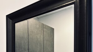 A closed wardrobe with two doors and a handle. - Firstclass Event & Hotel (Fuerth)