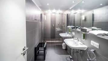 Shower, hair dryer, slippers, towels